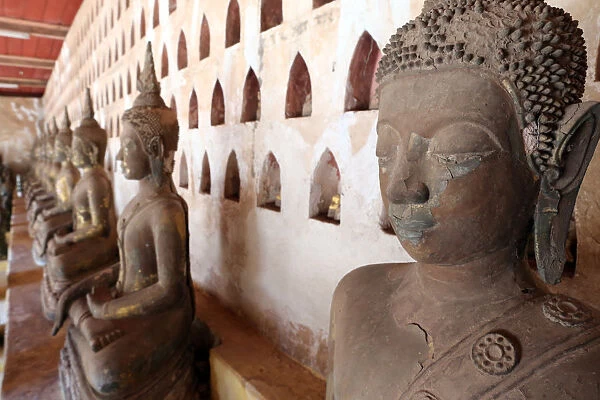 Old Buddha statues in the cloister around the Sim, Wat Sisaket (Si Saket) Buddhist temple