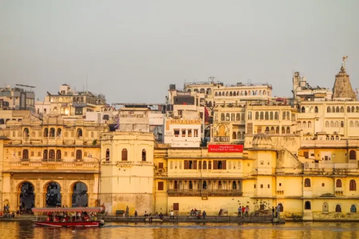 Framed Print : Old building facades, boat in foreground, City Palace side, Lake Pichola, Udaipur Framed Print : Old building facades, boat in foreground, City Palace side, Lake Pichola, Udaipur