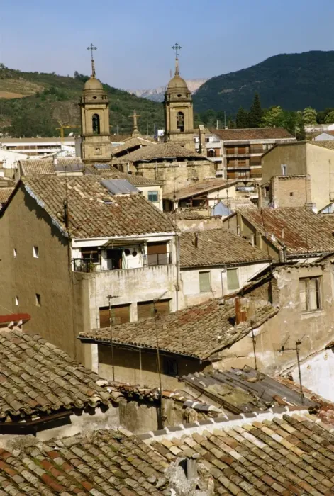 Framed Print : Old buildings with tiled roofs and a church behind Framed Print : Old buildings with tiled roofs and a church behind