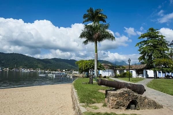 Old cannons on shore of the town of Paraty, Rio de Janeiro, Brazil, South America