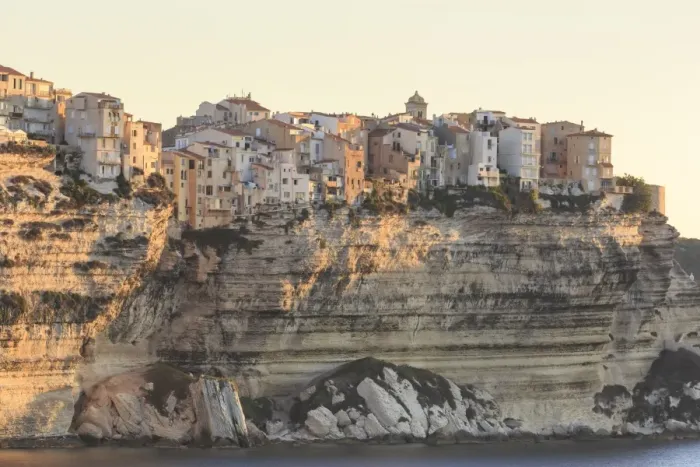 Framed Print : Old citadel townhouses and church at dawn, in early morning light, seen from the sea Framed Print : Old citadel townhouses and church at dawn, in early morning light, seen from the sea