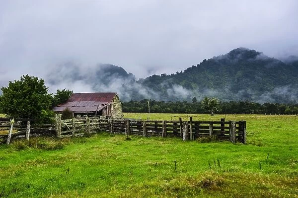 Old farm in a moody atmosphere, West Coast around Hst, South Island, New Zealand, Pacific