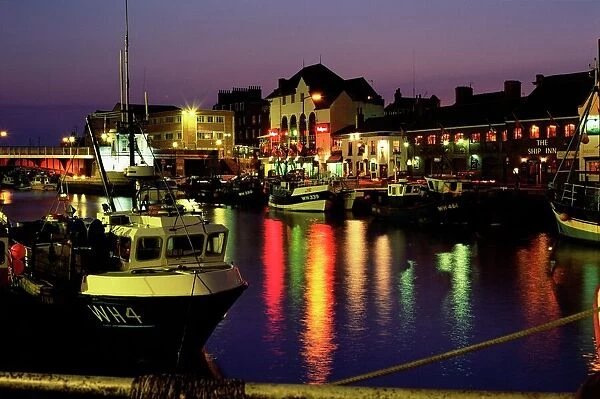 The Old Harbour, illuminated at dusk, Weymouth, Dorset, England, UK, Europe