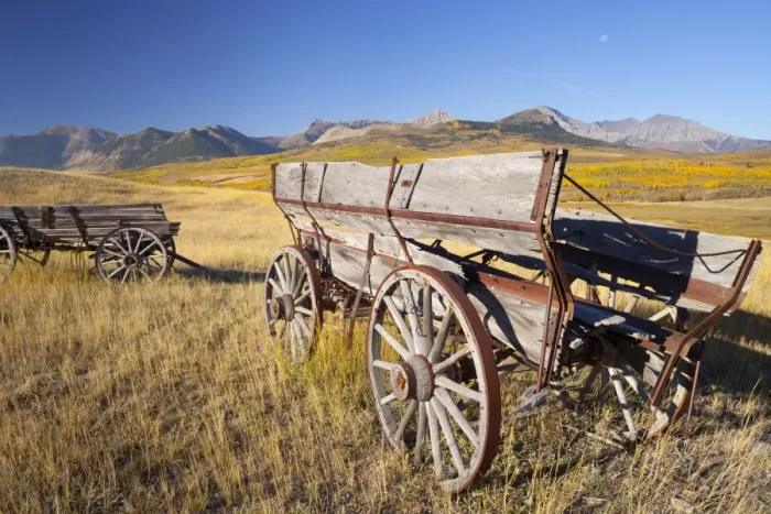 Framed Print : Old horse-drawn wagons with the Rocky Mountains in the background, near Waterton Framed Print : Old horse-drawn wagons with the Rocky Mountains in the background, near Waterton