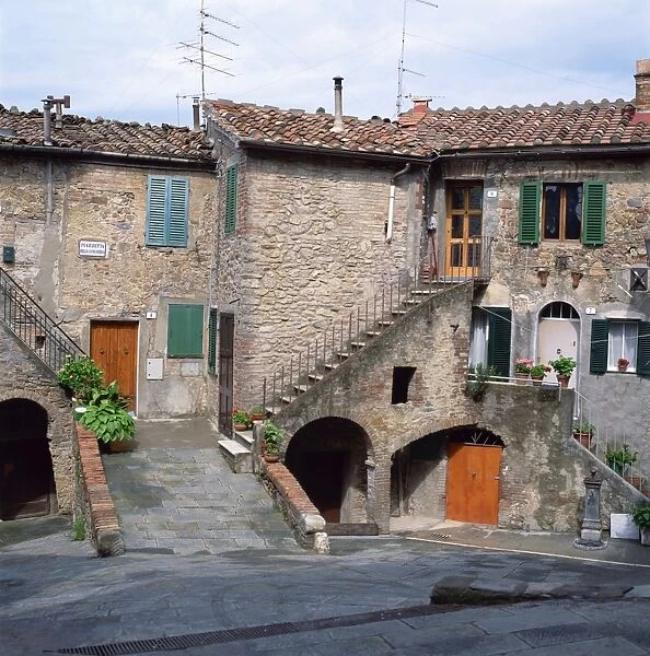 Old houses on a street in the village of Monteciano in Tuscany