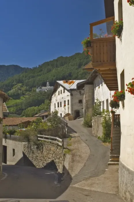Framed Print : Old houses in village street in Burgusio