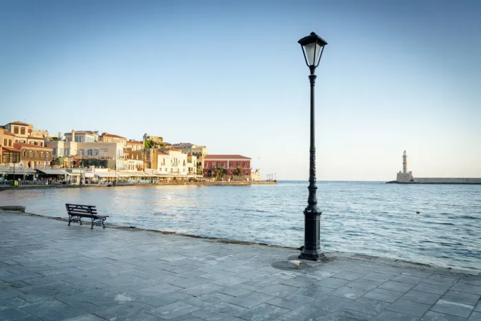 Framed Print : Old lantern in the Venetian harbour of Chania with lighthouse in background, Crete Framed Print : Old lantern in the Venetian harbour of Chania with lighthouse in background, Crete