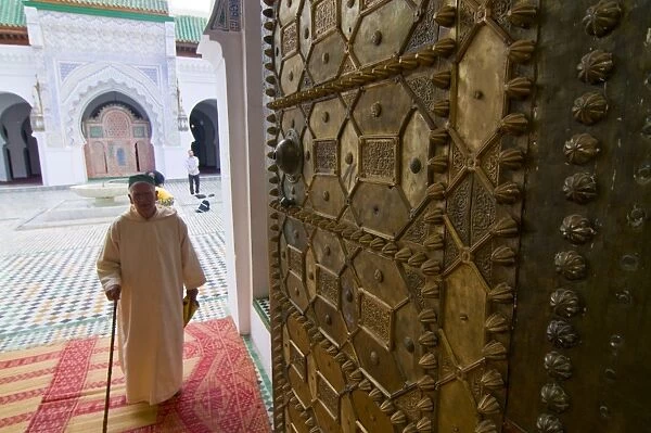 Old man leaving a mosque in the old Medina, UNESCO World Heritage Site