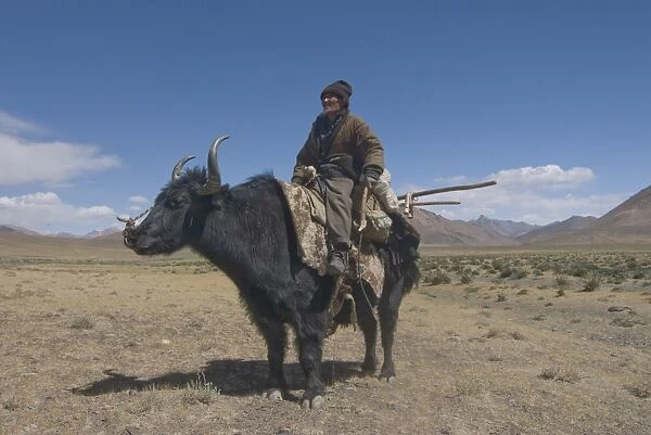 Old man riding on his yak, the Pamirs, Tajikistan, Central Asia, Asia