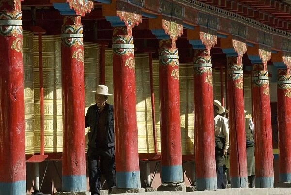 Old men turning prayer wheels, Tagong temple, Tagong, Sichuan, China, Asia