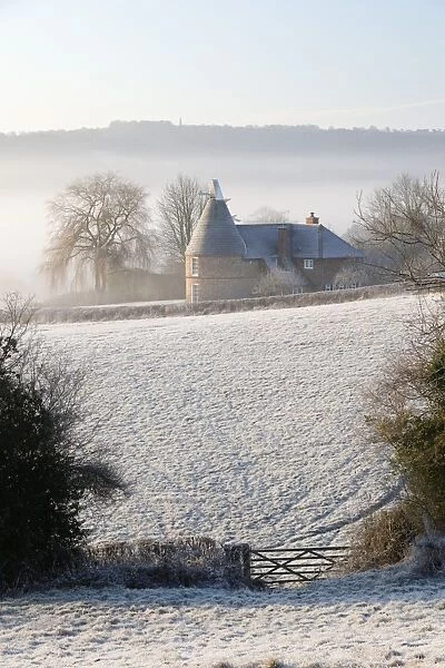 Old oast house in winter frost, Burwash, East Sussex, England, United Kingdom, Europe