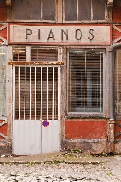 An old piano store in the city of Dijon, Burgundy, France, Europe