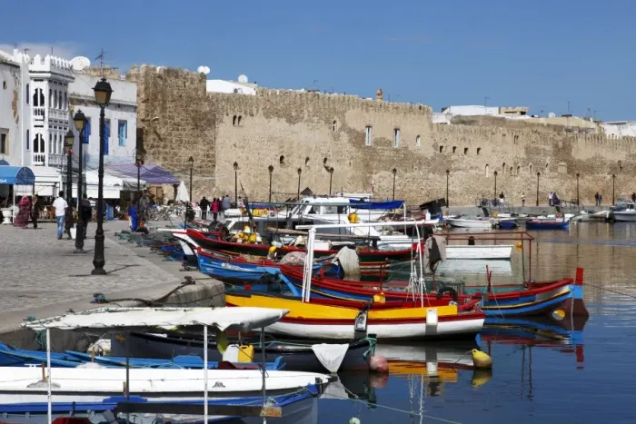 Framed Print : Old Port Canal, fishing boats and wall of the Kasbah, Bizerte, Tunisia Framed Print : Old Port Canal, fishing boats and wall of the Kasbah, Bizerte, Tunisia
