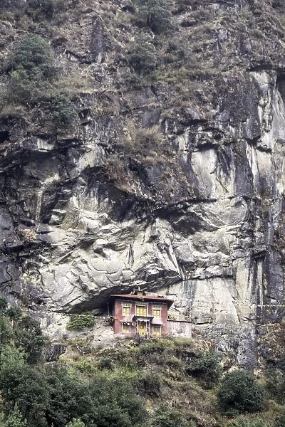 An old religious building built into the side of a cliff in the Sagarmatha National Park UNESCO World Heritage Site, Himalayas, Nepal, Asia