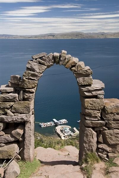 Old stone archway leading to the central village, Isla Taquille, Lake Titicaca