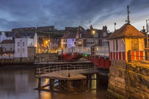 Old Swing Bridge over River Esk at dawn during the Christmas holidays, Whitby, North Yorkshire