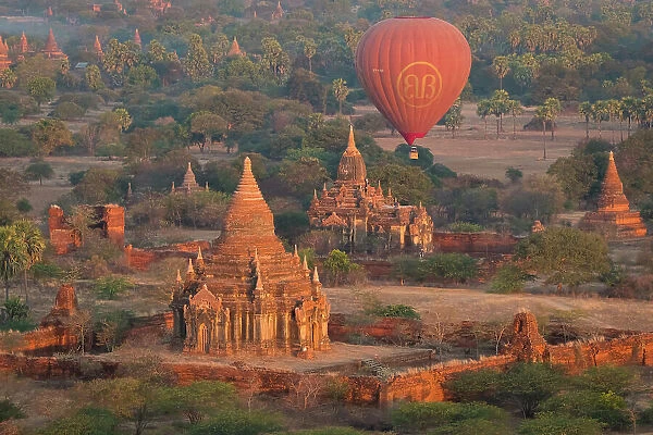 Old temple in Bagan and hot-air balloons before sunrise, Old Bagan (Pagan), UNESCO World Heritage Site, Myanmar (Burma), Asia