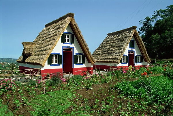 Old thatched farmhouses in gardens at Santana