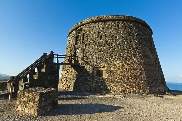 Old tower (toston), a defence against English pirates at this northwest coast village, El Cotillo, Fuerteventura, Canary Islands, Spain, Europe