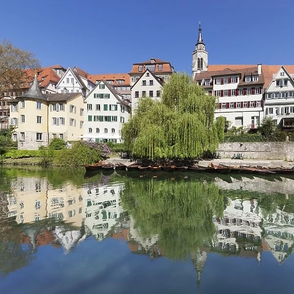 Old town with Hoelderlinturm tower and Stiftskirche Church reflecting in the Neckar River