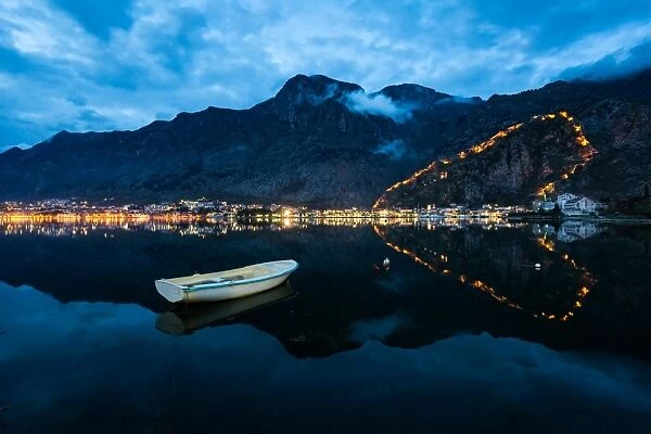 The Old Town (stari grad) and fortress of Kotor reflected in Kotor Bay, UNESCO World Heritage Site