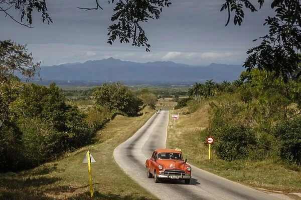 Old vintage American car on a road outside Trinidad, Sancti Spiritus Province, Cuba