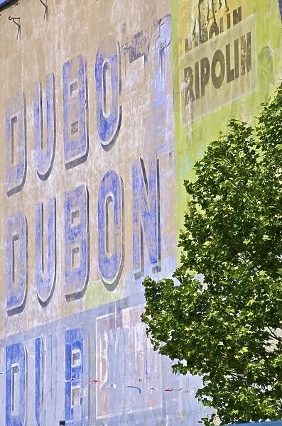 Old wall painted with publicity for Dubonnet aperitif, Sainte Anne square
