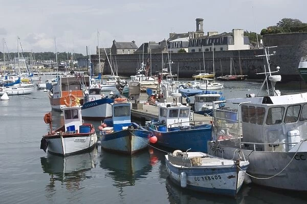 The old walled town of Concarneau seen from the fishing harbour, Southern Finistere