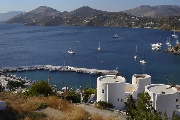Old windmills, restored as holiday accommodation above Panteli harbour, Leros, Dodecanese Islands