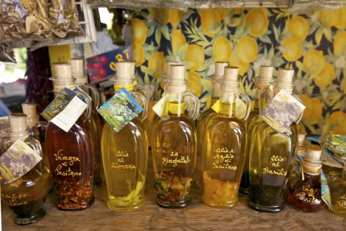 Framed Print : Olive oil for sale on market stall near Positano, Amalfi Coast road, Campania Framed Print : Olive oil for sale on market stall near Positano, Amalfi Coast road, Campania