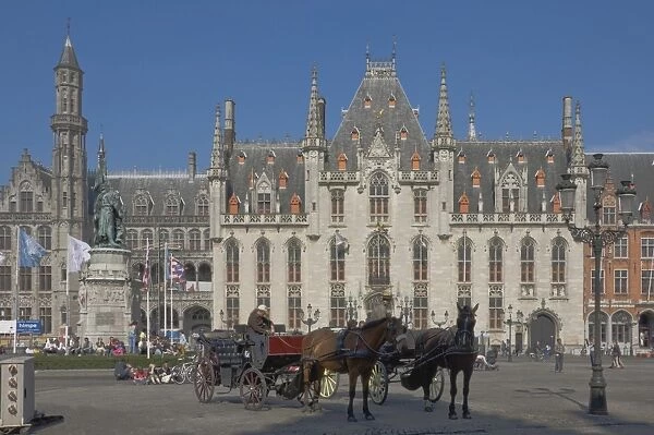 An open carraige awaits passengers on the Market Square in front of the Provincial Court Building, Brugge, UNESCO World Heritage Site, Belgium, Europe