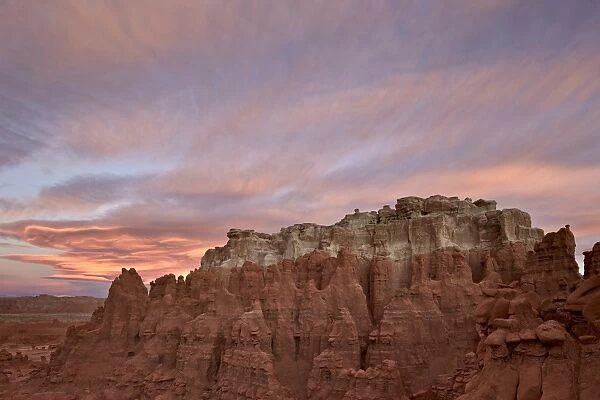 Orange clouds at dawn over the badlands, Goblin Valley State Park, Utah, United States of America, North America