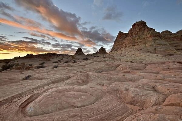 Orange clouds at sunrise above sandstone formations, Coyote Buttes Wilderness, Vermillion Cliffs National Monument, Arizona, United States of America, North America