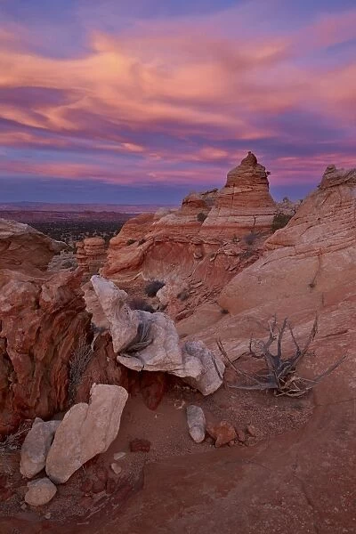 Orange clouds at sunset over sandstone cones, Coyote Buttes Wilderness, Vermilion