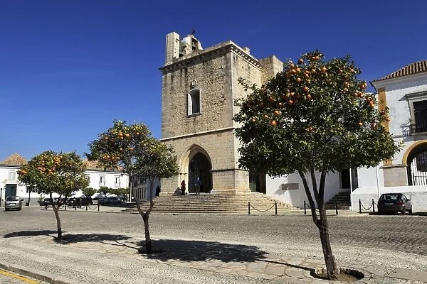 Orange trees grow outside of the Cathedral (Se) in the Old Town of Faro