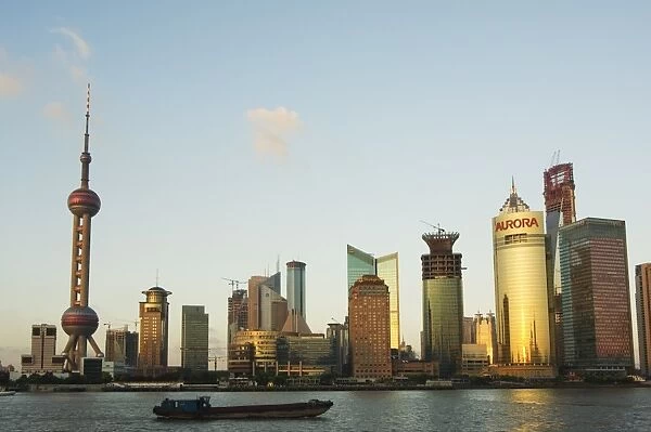 The Oriental Pearl Tower and modern buildings on the skyline in Pudong new area on the banks of Huangpu River, Pudong, Shanghai
