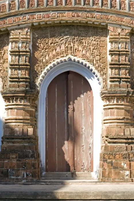 Framed Print : Ornate carving of Hindu myths above a door in the restored miniature terracotta Hindu temple in Baranagar, rural West Bengal