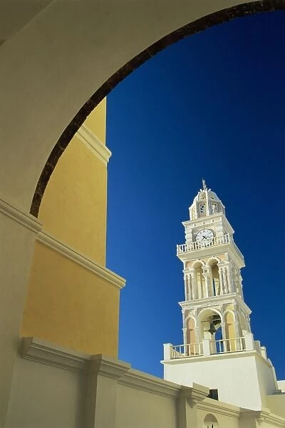 Ornate church belltower framed by painted archway