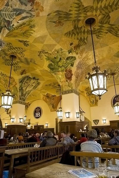 The ornate painted vaulted arch ceiling of the Hofbraeuhaus in Munich, Bavaria