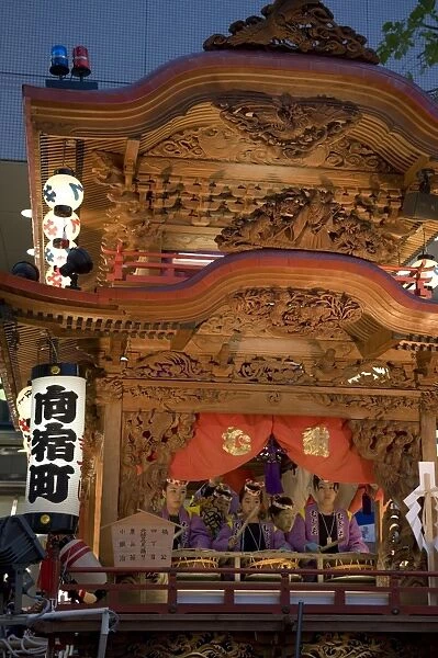 Ornate wooden floats with musicians performing during the Gotenyatai Hikimawashi Festival in Hamamatsu, Shizuoka