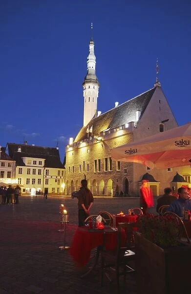 Outdoor cafes in Town Hall Square (Raekoja Plats) at dusk with Town Hall in background