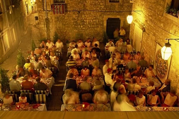 Outdoor restaurant at night in the town of Dubrovnik, Croatia, Europe