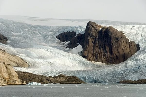 Outlet glaciers descending from main ice sheet, along north side of Prins Christian Sund