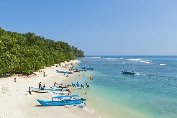 Outrigger boats on beautiful white sand beach in the national park on the south coast at Pangandaran, West Java, Java, Indonesia, Southeast Asia, Asia