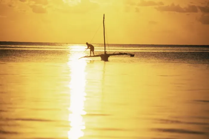 Framed Print : Outrigger canoe and fisherman in silhouette at sunrise off Jambiani, Zanzibar Framed Print : Outrigger canoe and fisherman in silhouette at sunrise off Jambiani, Zanzibar