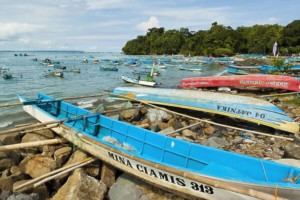 Outrigger fishing boats on the east side of the isthmus at this south coast resort town, Pangandaran, West Java, Java, Indonesia, Southeast Asia, Asia