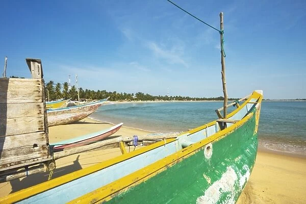 Outrigger fishing boats on this popular surf beach, badly hit by the 2004 tsunami, Arugam Bay, Eastern Province, Sri Lanka, Asia