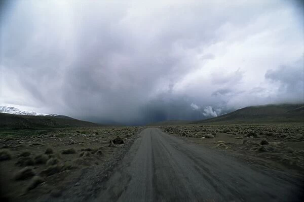 Overcast sky above the road into the Andes mountains, Parque Nacional Volcan Isluga