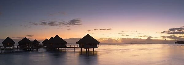 Overwater bungalows at Le Meridien Tahiti Hotel at sunset, Papeete, Tahiti, French Polynesia