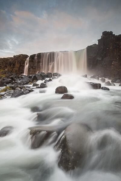 Oxarafoss waterfall at sunrise in Thingvellir National Park, UNESCO World Heritage Site